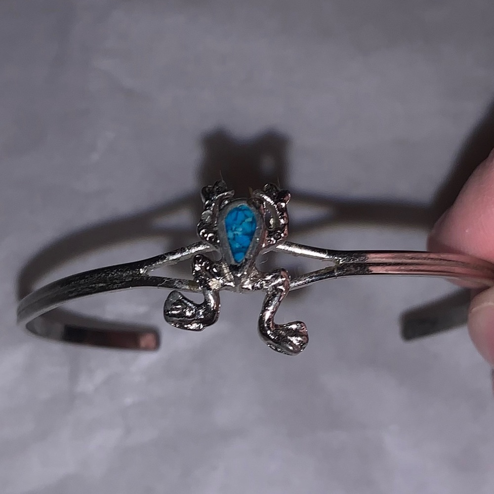 Silver frog bracelet with small blue detail